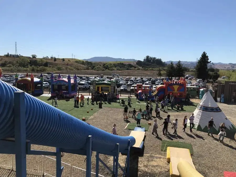 Families playing at the slide area at Pronzini Farms pumpkin patch